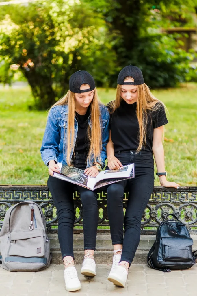 Two female students studying notes